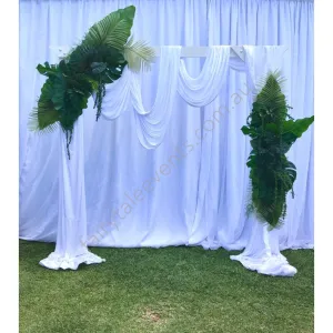 Tropical leaf on white arbour with drape